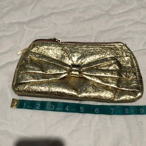 Gold bow makeup case w rhinestone detail